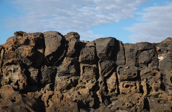 Porous lava volcanic rock around around Playa de la Concha beach in El Cotillo La Oliva municipality of Fuerteventura, Canary Islands