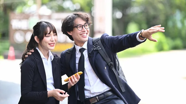 Two Cheerful Young Business People Talking Each Other While Standing — Stock Photo, Image