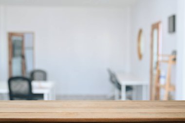 Empty wooden table with blurred background of cafe. For your product display montage.