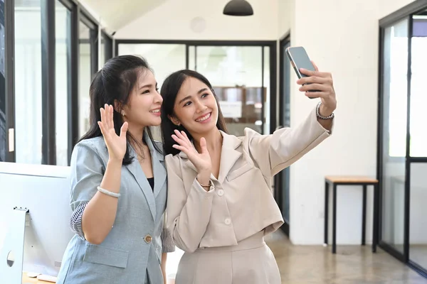 Two Cheerful Woman Waving Hand While Doing Video Call Smart — Stock Photo, Image