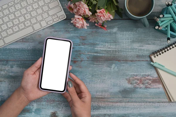 Woman hands using smart phone over wooden table. Empty screen for graphic display montage. — Stock Photo, Image