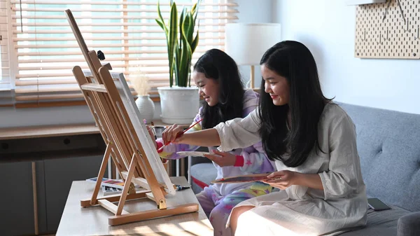 Two Cute Asian Girls Enjoying Painting Picture While Spending Leisure — Stock Photo, Image