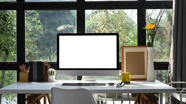 Modern workplace with computer pc and supplies. Blank screen for your text message or information content.