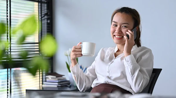Smiling Asian Woman Holding Coffee Cup Enjoy Phone Conversation Her — Stock Photo, Image