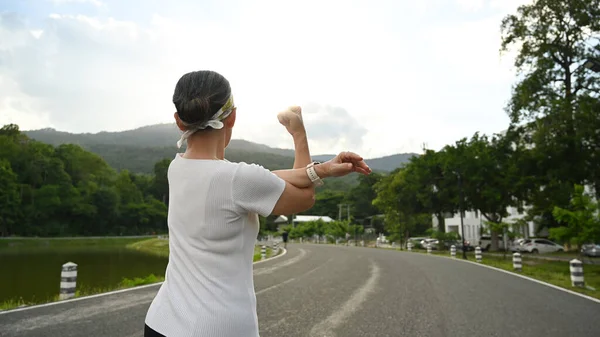 Active Healthy Middle Aged Woman Stretching Arm Warming Morning Workout — Stok fotoğraf