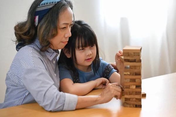 Asian Grandma Cute Little Granddaughter Playing Wood Blocks Tower Game — Stock Photo, Image