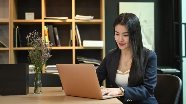 Pleasant Asian Businesswoman Typing Business Email Searching Information Her Laptop — Fotografia de Stock