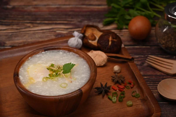 Rice Porridge Boiled Egg Sliced Ginger Slice Scallion Wooden Table — 图库照片