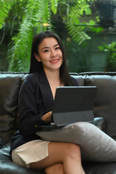 Confident Millennial Businesswoman Sitting Couch Digital Tablet Smiling Camera — ストック写真