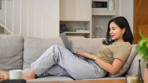 Pleasant Young Asian Woman Surfing Internet Chatting Social Networks Laptop — Stockfoto