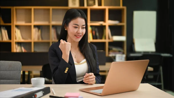 Happy Asian Female Entrepreneur Looking Laptop Screen Celebrating Business Success — ストック写真