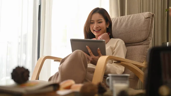 Happy Young Woman Resting Armchair Watching Videos Surfing Internet Digital — Zdjęcie stockowe