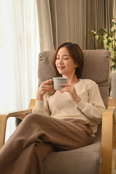 Pleasant Young Woman Resting Comfortable Armchair Drinking Hot Tea Spending — Fotografia de Stock