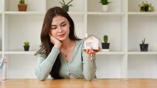 Thoughtful Young Woman Holding House Model Keys Real Estate Mortgage — Fotografia de Stock