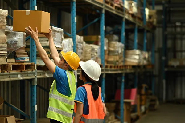 Male Warehouse Workers Manager Wearing Hardhats Reflective Jackets Checking Stock — 스톡 사진