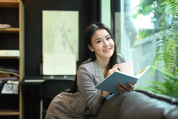 Charming Millennial Businesswoman Resting Taking Break Work Reading Book Sofa — Stockfoto