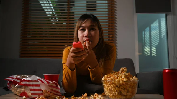 Young Lady Remote Control Enjoying Interesting Movie Eating Popcorn Sofa — Fotografia de Stock