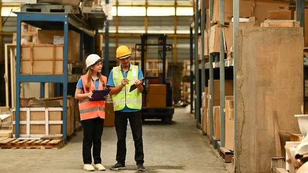 Full Length Female Managers Worker Checking Inventory Warehouse Shelves Full — Stock fotografie