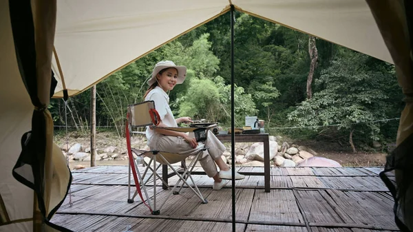 Peaceful Asian Woman Sitting Folding Chair River Bank Camping Nature — Stockfoto