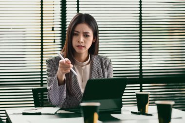 Dissatisfied boss scolding young employees during corporate meeting. Emotional pressure, stress at work concept.