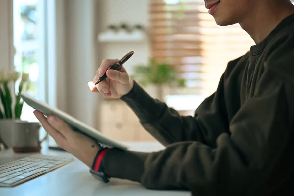 Man Freelancer Holding Pen Using Digital Tablet While Working Online — ストック写真