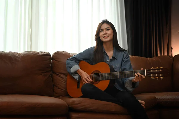 Joyful Young Woman Playing Acoustic Guitar Couch Spending Leisure Time — 스톡 사진