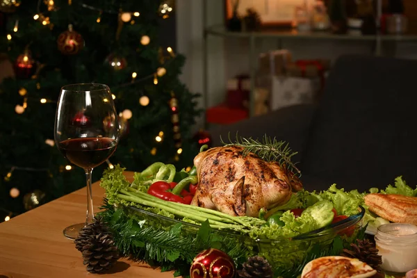 Image of thanksgiving table with baked turkey, glass of red wine and candle. Thanksgiving celebration traditional dinner concept.