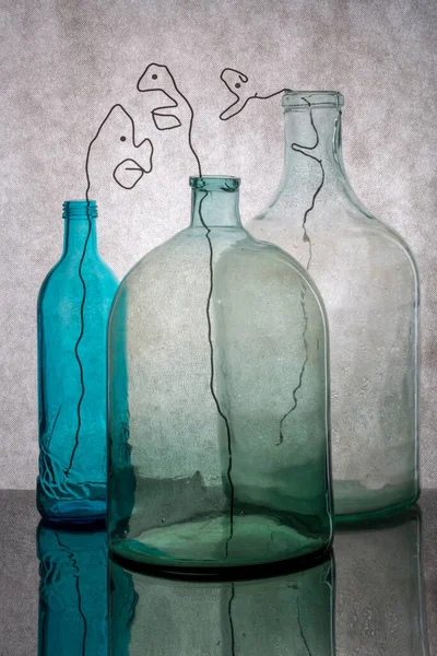 Still Life Glass Bottles Silhouette Human Head Made Wire — Stock Photo, Image