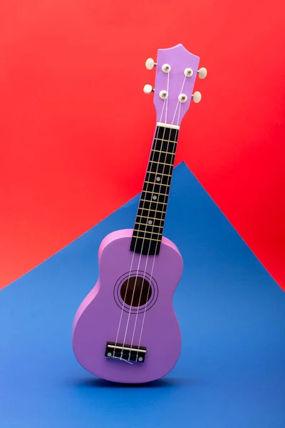 Four String Ukulele Guitar Red Blue Background — Stock Photo, Image