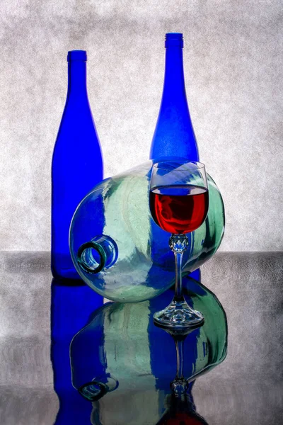 Still Life Blue Bottles Glass Red Wine Glass Bottle — Stock Photo, Image