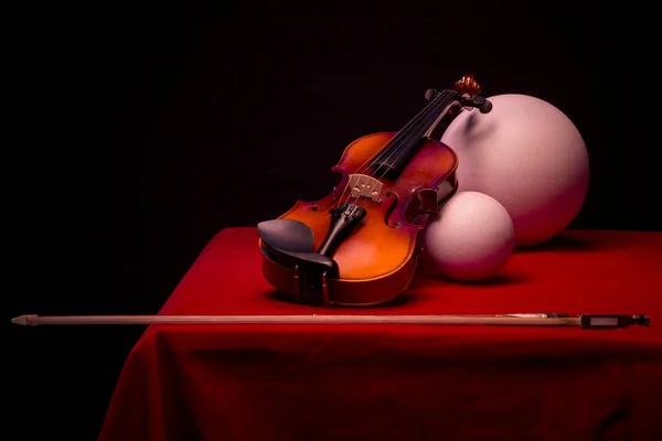 Still Life Violin Balls Bow Red Table — Stock Photo, Image