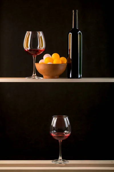 Still Life Multicolored Balls Plate Bottle Glasses Wine — Stock Photo, Image