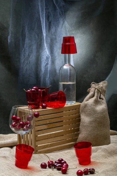 Still Life Bags Ripe Cherries Glass Bottle — Photo