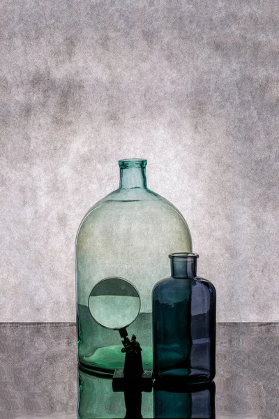 Still Life Glass Jars Magnifying Glass — Stock Photo, Image