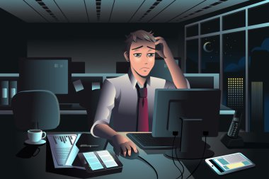 gece geç saatte ofiste çalışan iş adamı