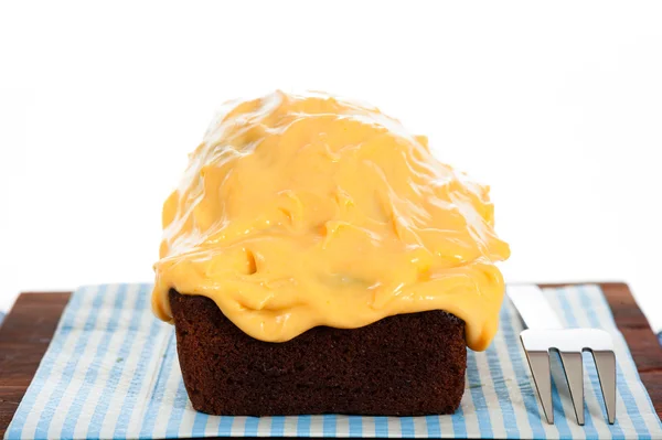Cake with yellow icing — Stock Photo, Image