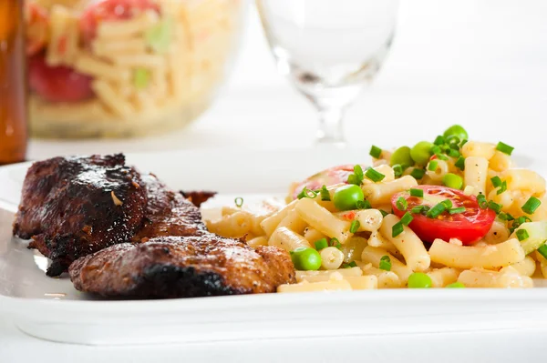 Steak and pasta — Stock Photo, Image