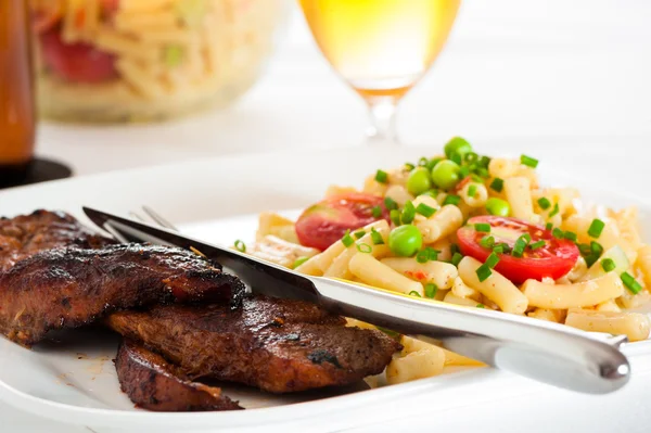 Steak and pasta — Stock Photo, Image