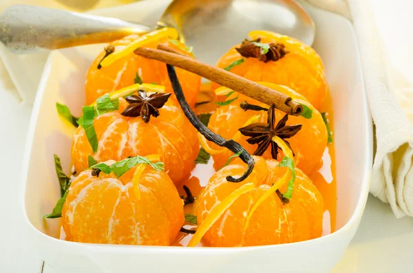 Mandarins in spiced syrup — Stock Photo, Image