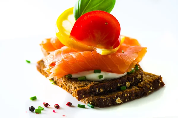 Canapes with smoked salmon — Stock Photo, Image