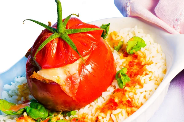 One stuffed tomato on a white plate — Stock Photo, Image