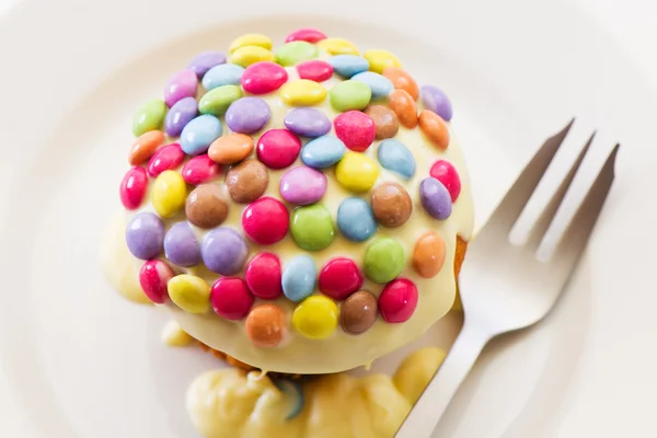 Cupcake and smarties — Stock Photo, Image