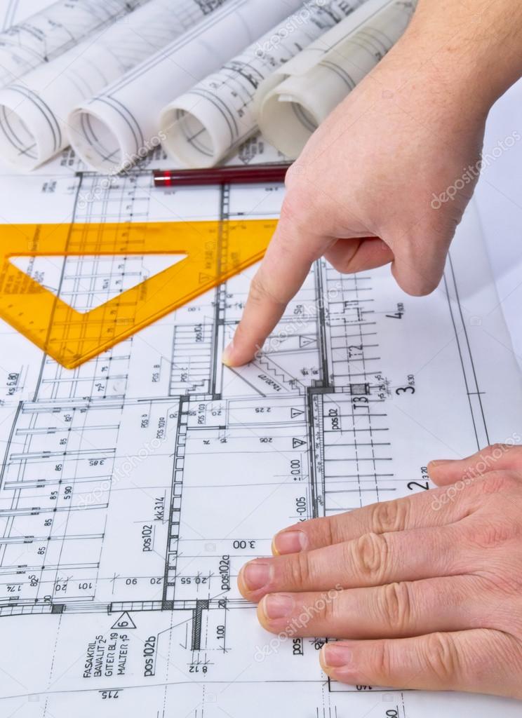 Architect rolls and plans blueprints planning interiors design construction real estate