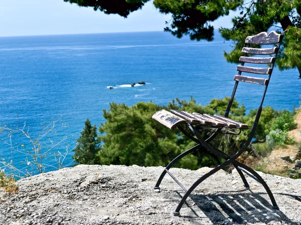 Chair by the cliff sea view scenery — Stock Photo, Image