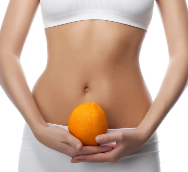 Attractive woman with orange — Stock Photo, Image