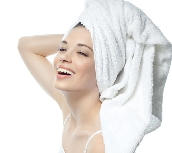 Smiling woman with towel on head — Stock Photo, Image