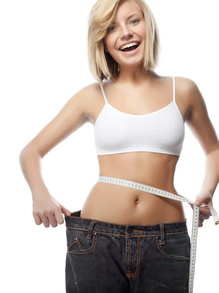 Frau riesige Jeans mit Maß — Stockfoto