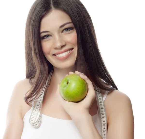Vrouw met apple en meting — Stockfoto