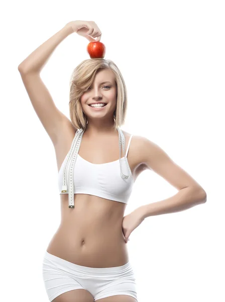 Mulher com maçã e medida — Fotografia de Stock