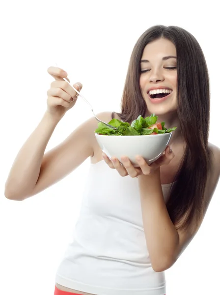 Mujer sonriente está comiendo salat — Foto de Stock